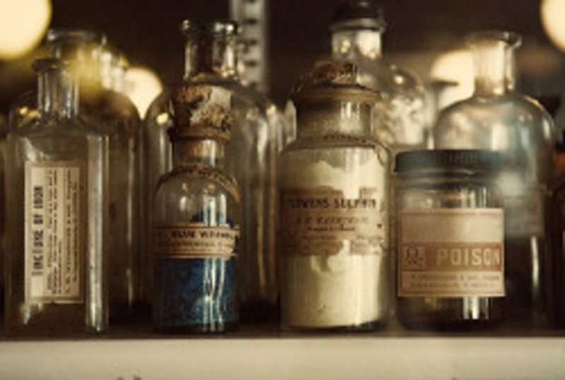 A pleasant photo of some antique labeled bottles. A pleasant photo of some antique labeled bottles.