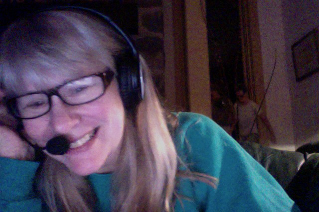 Nancy Birnes in front of a framed best-seller.