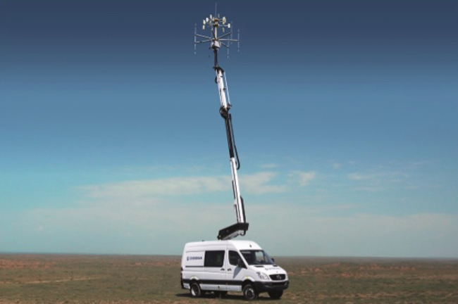 A photo of a radar tower on top of an ordinary vehicle. A photo of a radar tower on top of an ordinary vehicle.