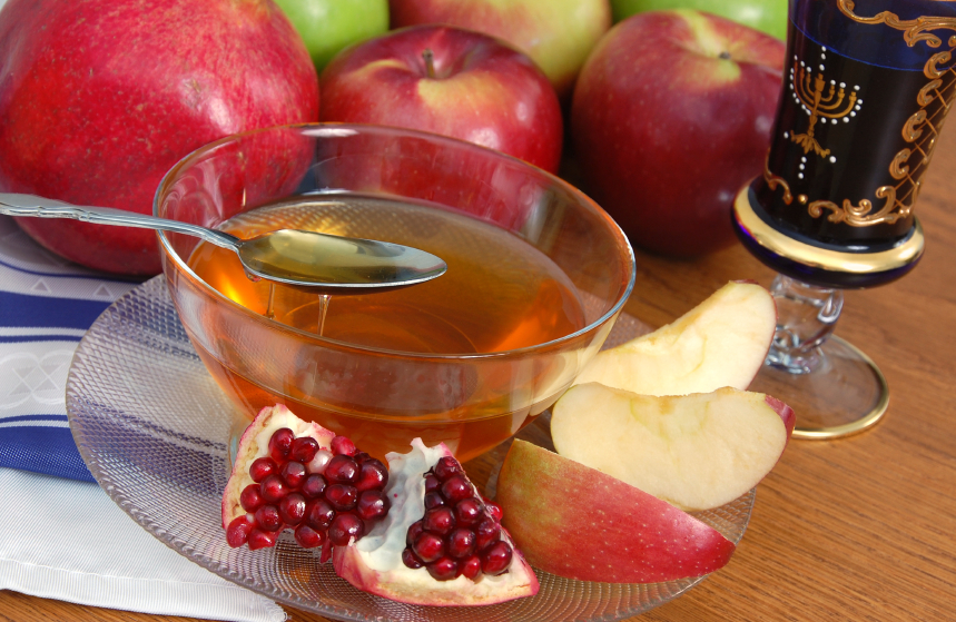 Photo of honey, apples, pomegranate. Photo of honey, apples, pomegranate.